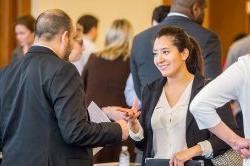 Student talking to representative at career fair